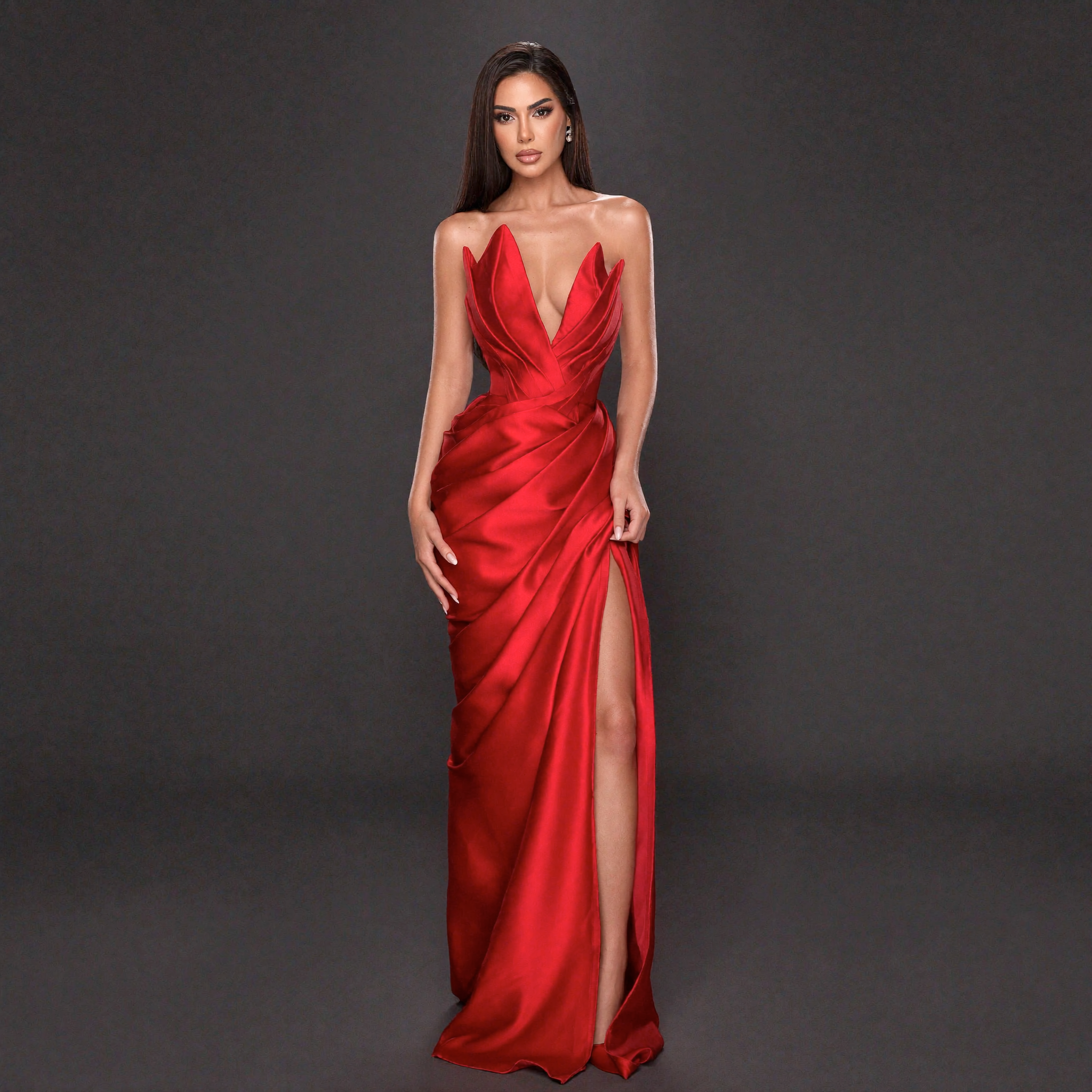 Red Satin Strapless Gown with Sculpted Deep V Neckline, Draped Waist, High Slit and Elegant Column Silhouette