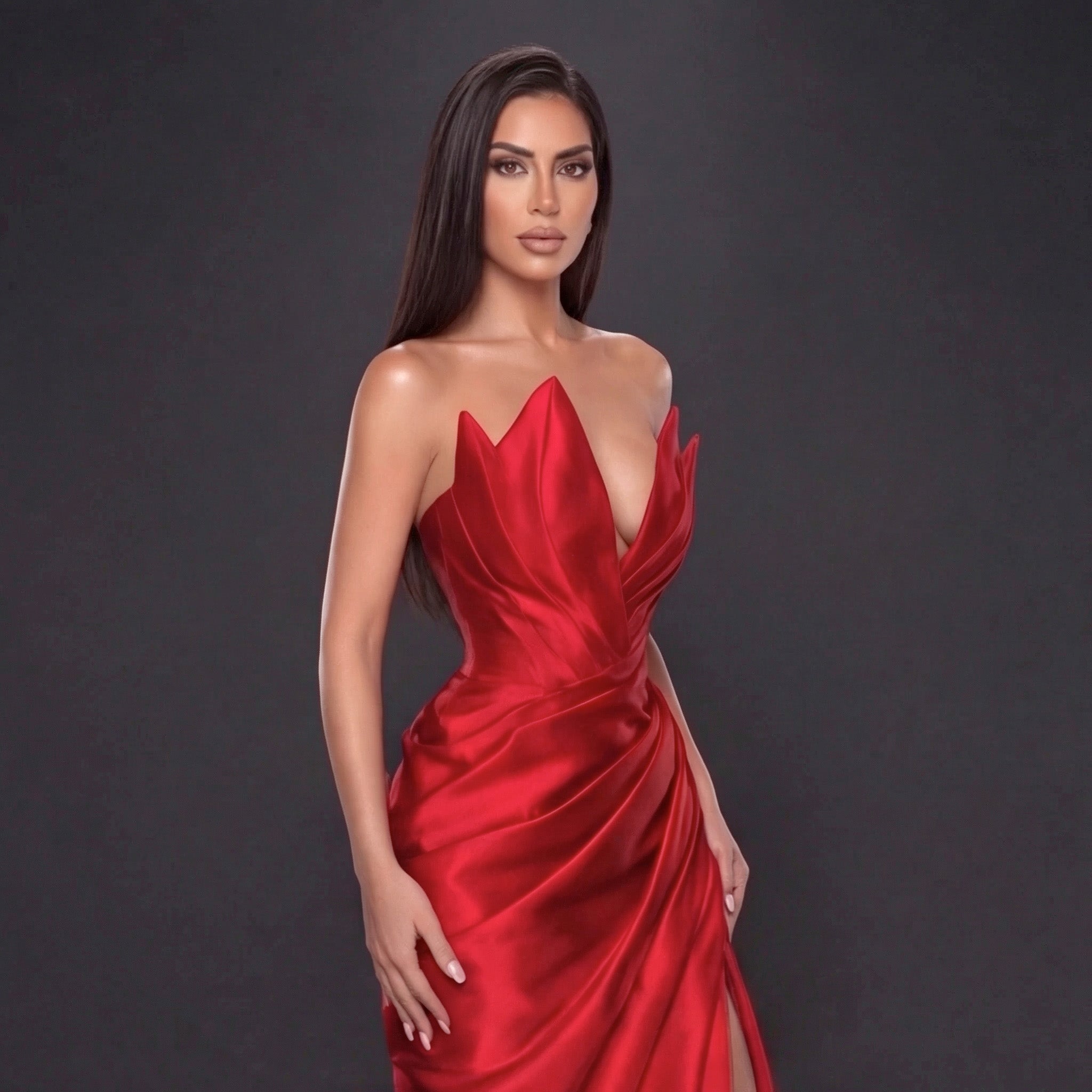 Red Satin Strapless Gown with Sculpted Deep V Neckline, Draped Waist, High Slit and Elegant Column Silhouette