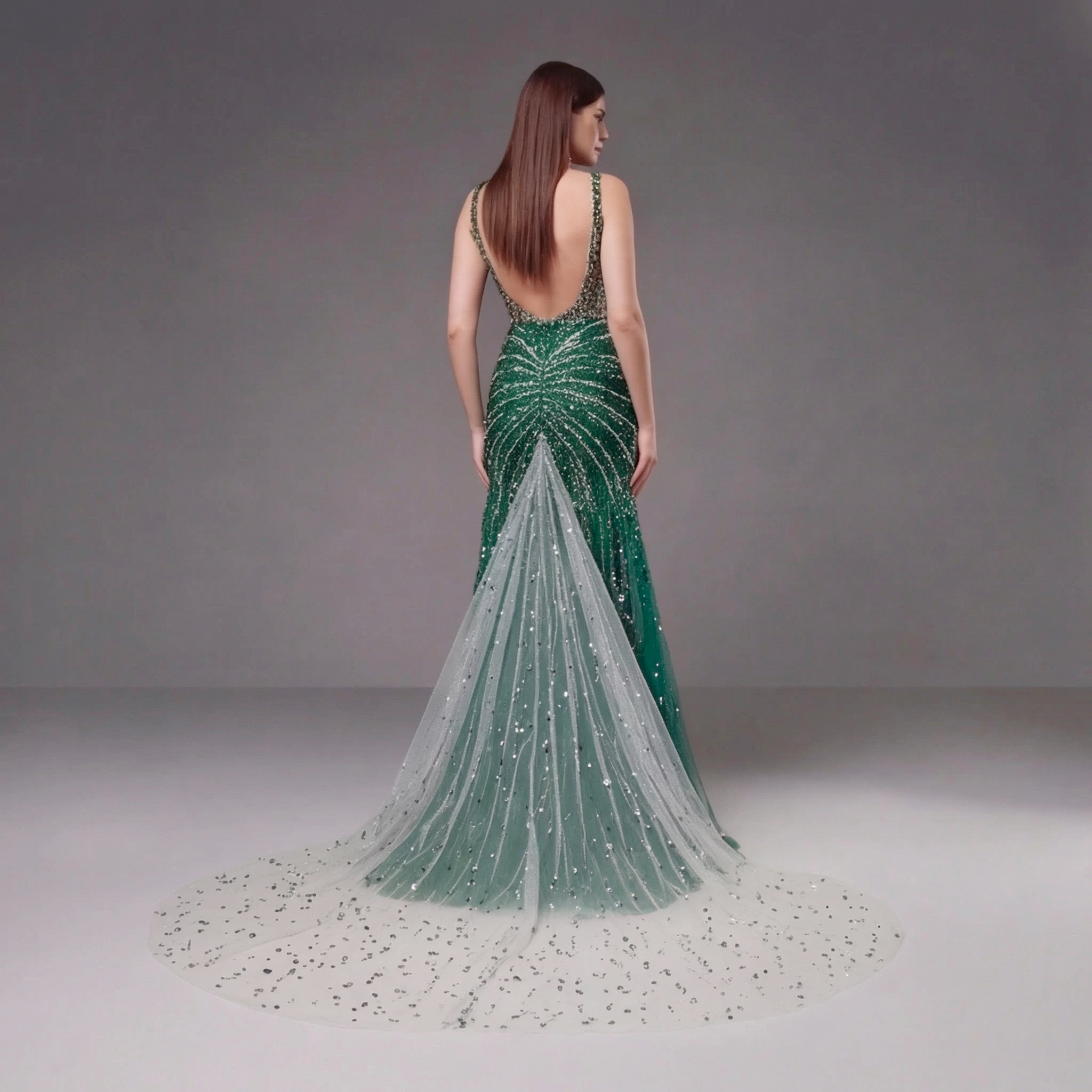 Emerald Green Crystal Embellished Deep V-Neck Mermaid Gown with Architectural Waist Detail and High Slit