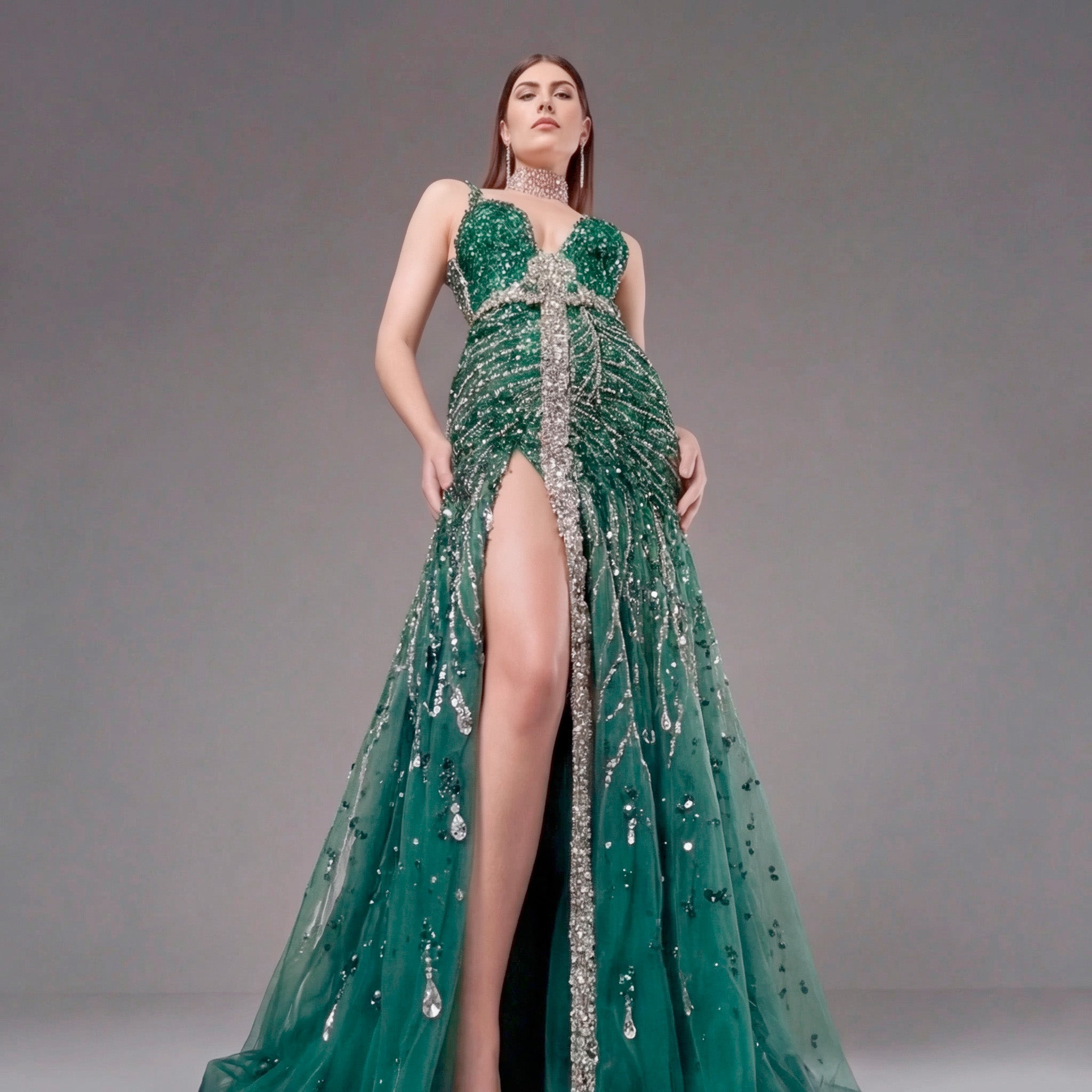 Emerald Green Crystal Embellished Deep V-Neck Mermaid Gown with Architectural Waist Detail and High Slit