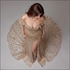 Nude Gold Off-Shoulder Mermaid Gown with Sheer Corset Bodice, Crystal Embellishments, High Slit and Glitter Tulle Train