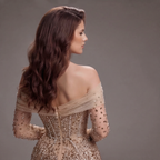 Nude Gold Off-Shoulder Mermaid Gown with Illusion Long Sleeves, Sheer Corset Bodice, Crystal Embellishments and High Slit Train