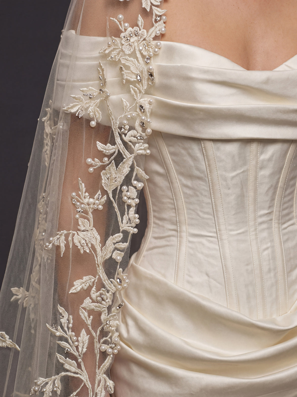 Pearl Ivory Draped Satin Bridal Gown – Sculpted Corset Bodice, Off-Shoulder Neckline & Floral Lace Cathedral Veil