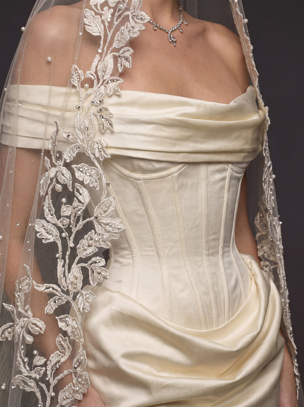 Champagne Ivory Sculpted Satin Mermaid Wedding Gown – Draped Off-Shoulder Neckline, Basque Waist Corset & Pearl Floral Cathedral Veil