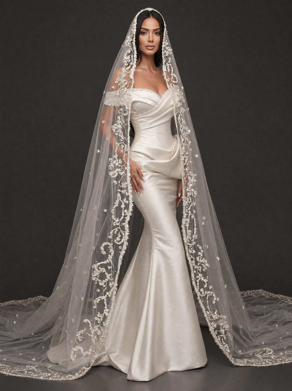 Pearl-Trimmed Satin Mermaid Wedding Dress – Off-Shoulder Draped Corset Gown with Sculpted Hip Detail & Floral Lace Cathedral Veil