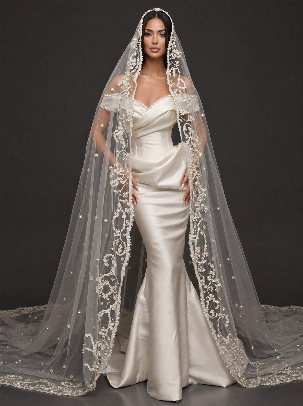 Pearl-Trimmed Satin Mermaid Wedding Dress – Off-Shoulder Draped Corset Gown with Sculpted Hip Detail & Floral Lace Cathedral Veil
