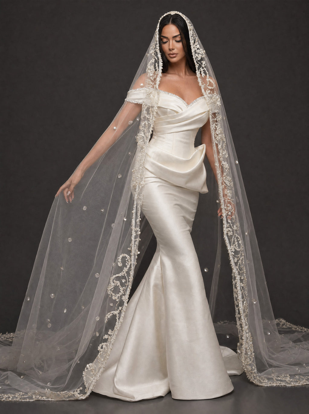 Pearl-Trimmed Satin Mermaid Wedding Dress – Off-Shoulder Draped Corset Gown with Sculpted Hip Detail & Floral Lace Cathedral Veil