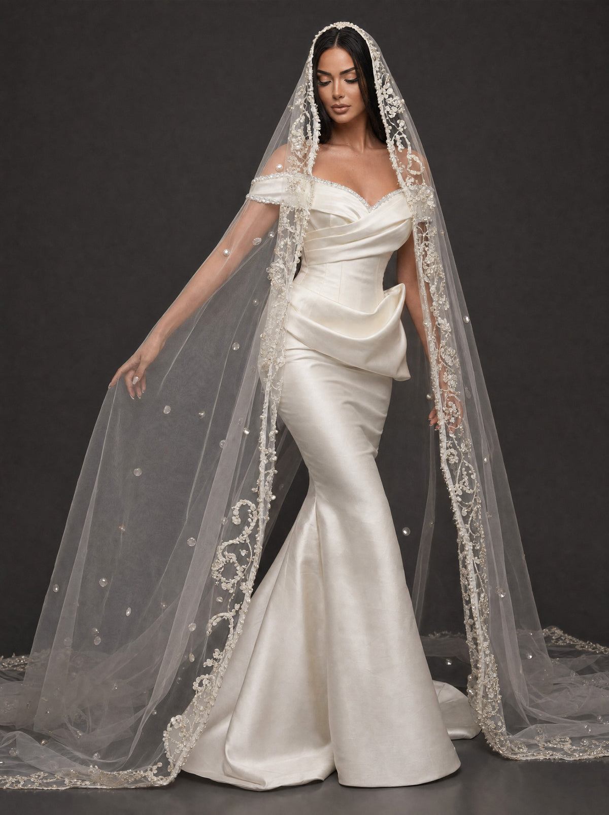 Pearl-Trimmed Satin Mermaid Wedding Dress – Off-Shoulder Draped Corset Gown with Sculpted Hip Detail & Floral Lace Cathedral Veil