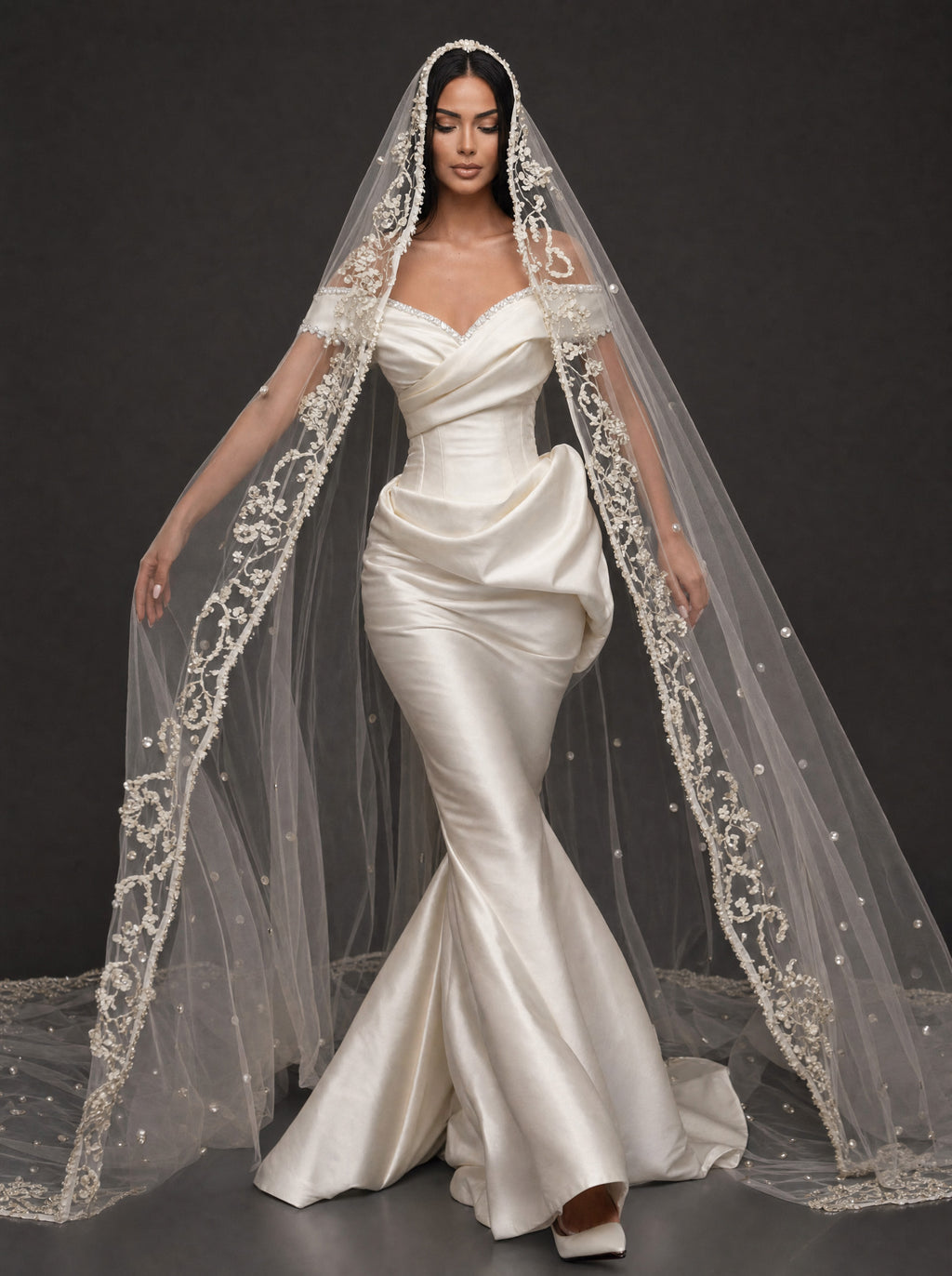 Pearl-Trimmed Satin Mermaid Wedding Dress – Off-Shoulder Draped Corset Gown with Sculpted Hip Detail & Floral Lace Cathedral Veil
