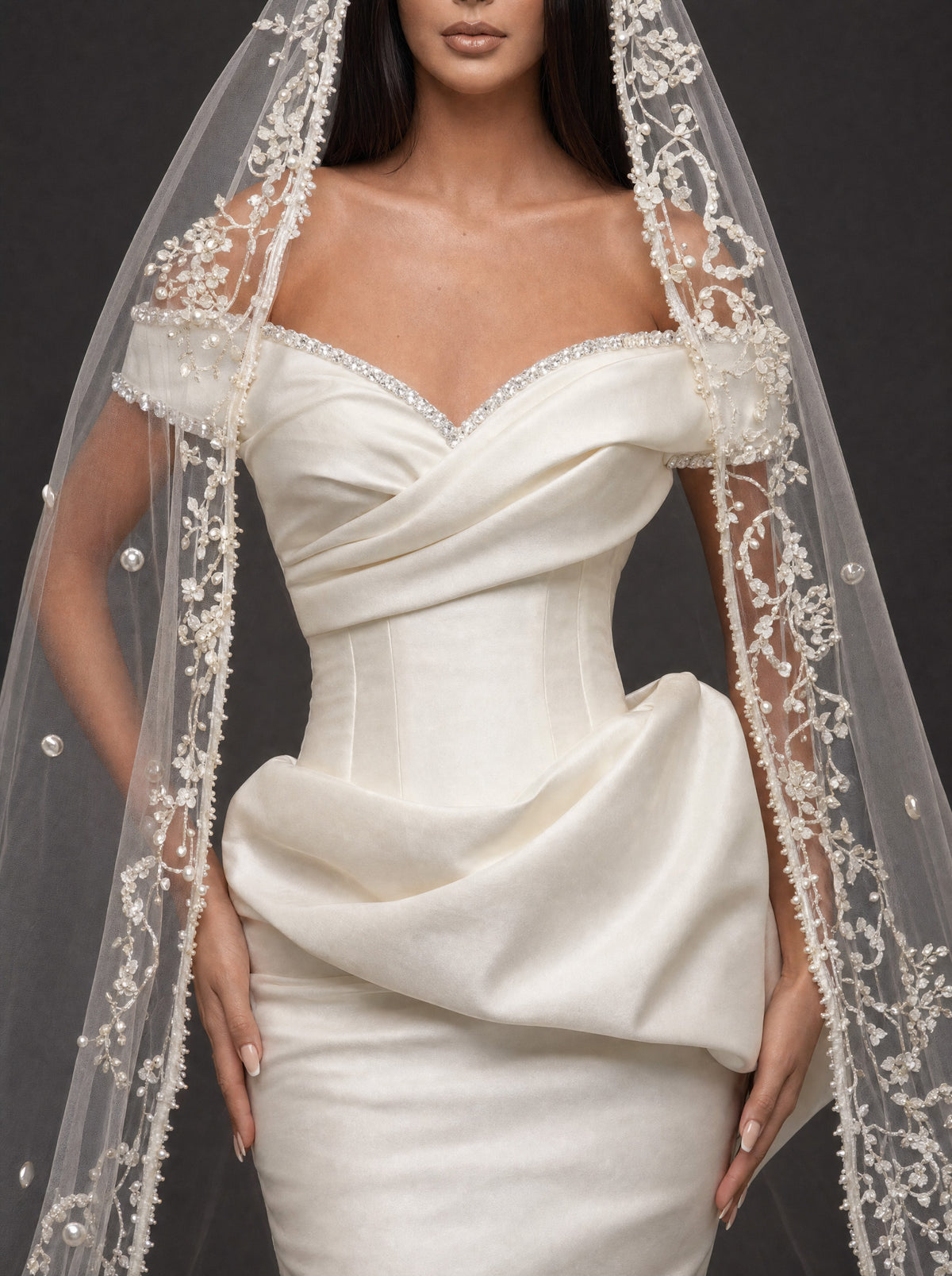 Pearl-Trimmed Satin Mermaid Wedding Dress – Off-Shoulder Draped Corset Gown with Sculpted Hip Detail & Floral Lace Cathedral Veil