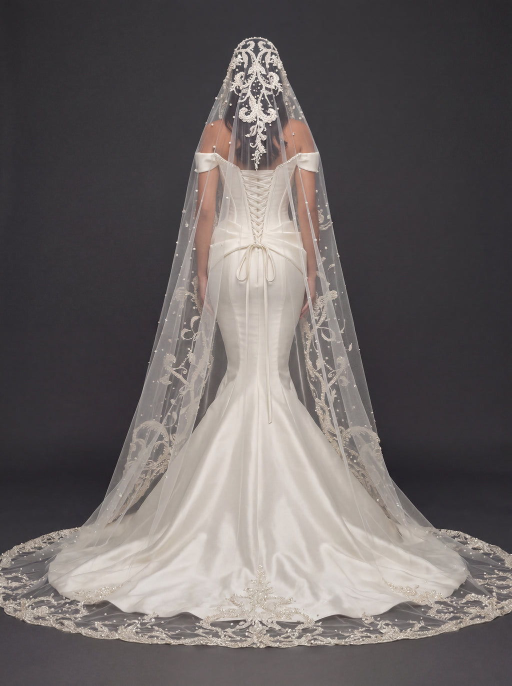 Sculpted Ivory Satin Mermaid Wedding Gown – Plunging Sweetheart Corset with Draped Waist & Embroidered Cathedral Veil