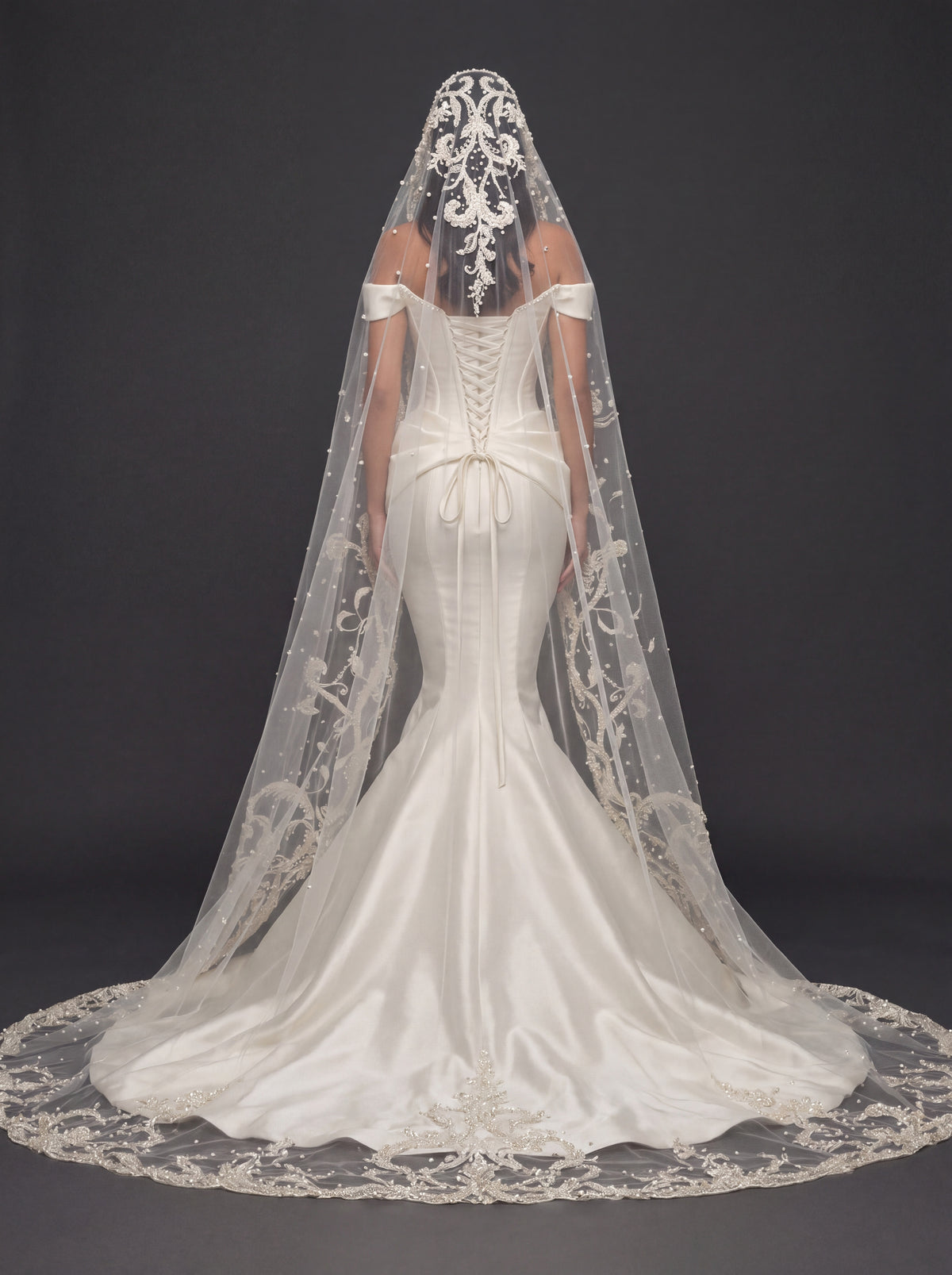 Sculpted Ivory Satin Mermaid Wedding Gown – Plunging Sweetheart Corset with Draped Waist & Embroidered Cathedral Veil