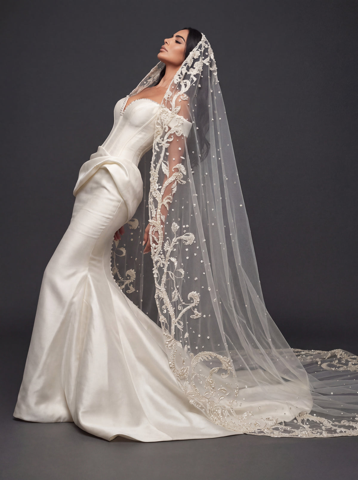 Sculpted Ivory Satin Mermaid Wedding Gown – Plunging Sweetheart Corset with Draped Waist & Embroidered Cathedral Veil
