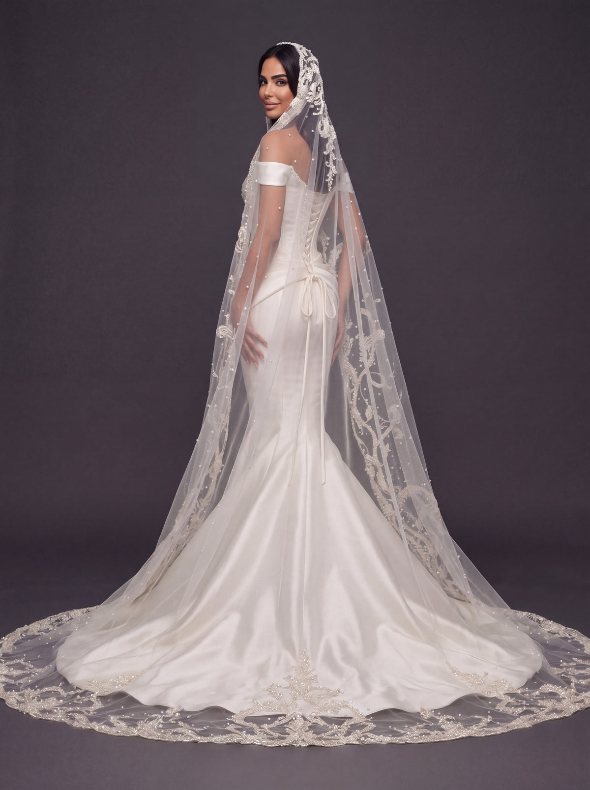 Sculpted Ivory Satin Mermaid Wedding Gown – Plunging Sweetheart Corset with Draped Waist & Embroidered Cathedral Veil