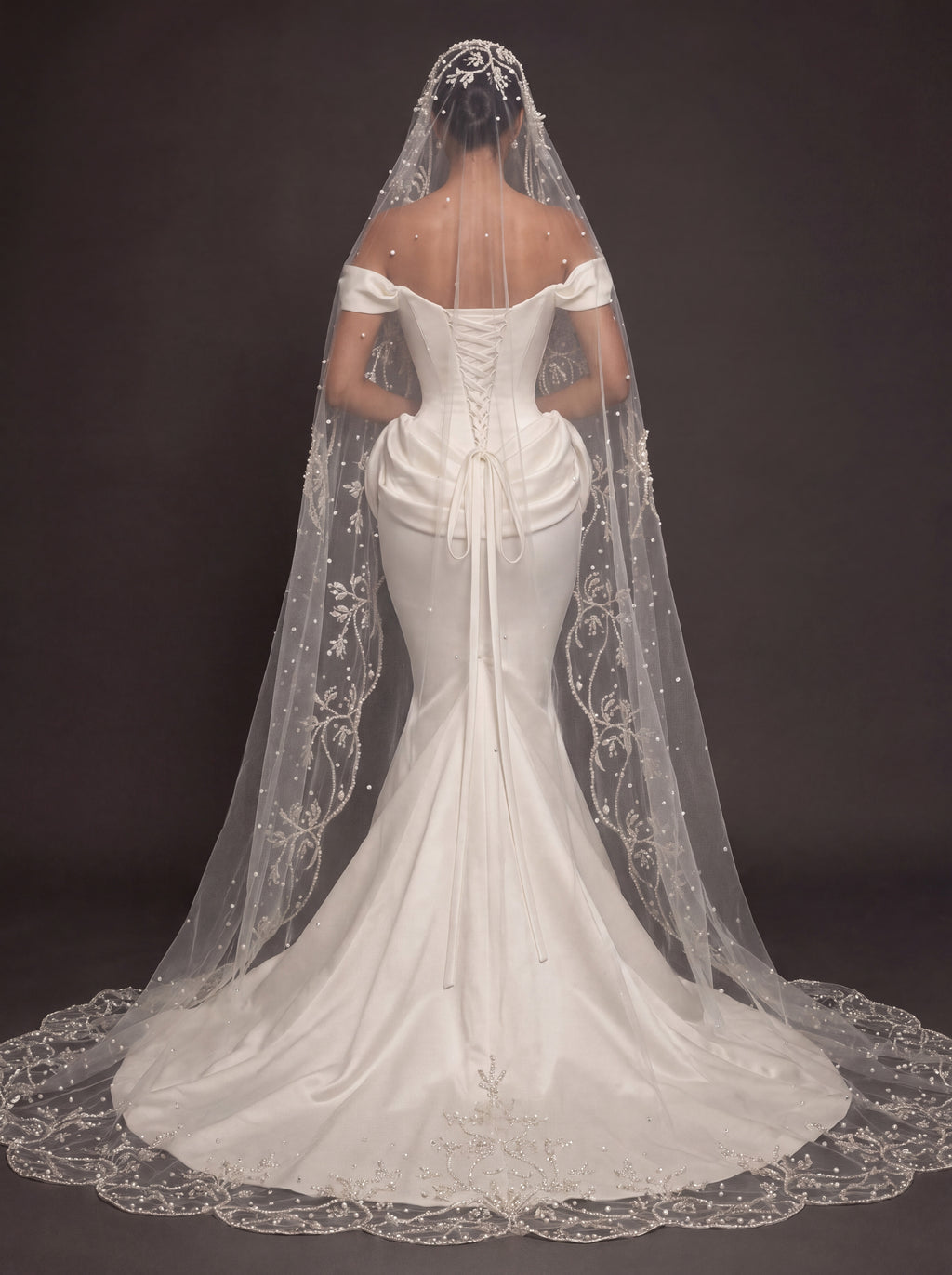 Pearl Button Ivory Satin Mermaid Wedding Gown – Off-Shoulder Sweetheart Corset with Draped Hips & Embroidered Cathedral Veil
