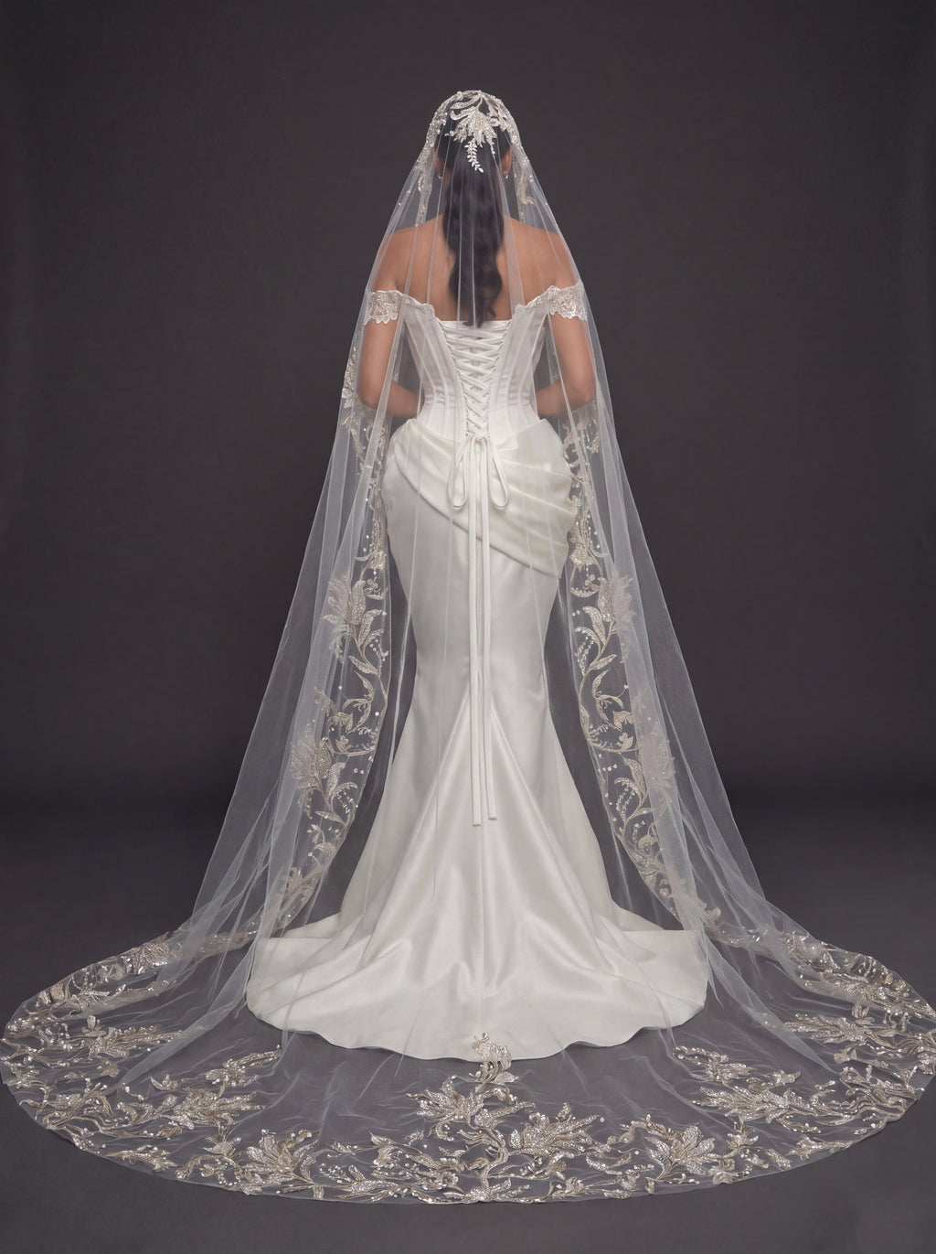 Ivory Satin Sculpted Corset Wedding Gown – Deep V-Neckline, Off-Shoulder Sleeves, Draped Mermaid Skirt & Floral Embroidered Cathedral Veil