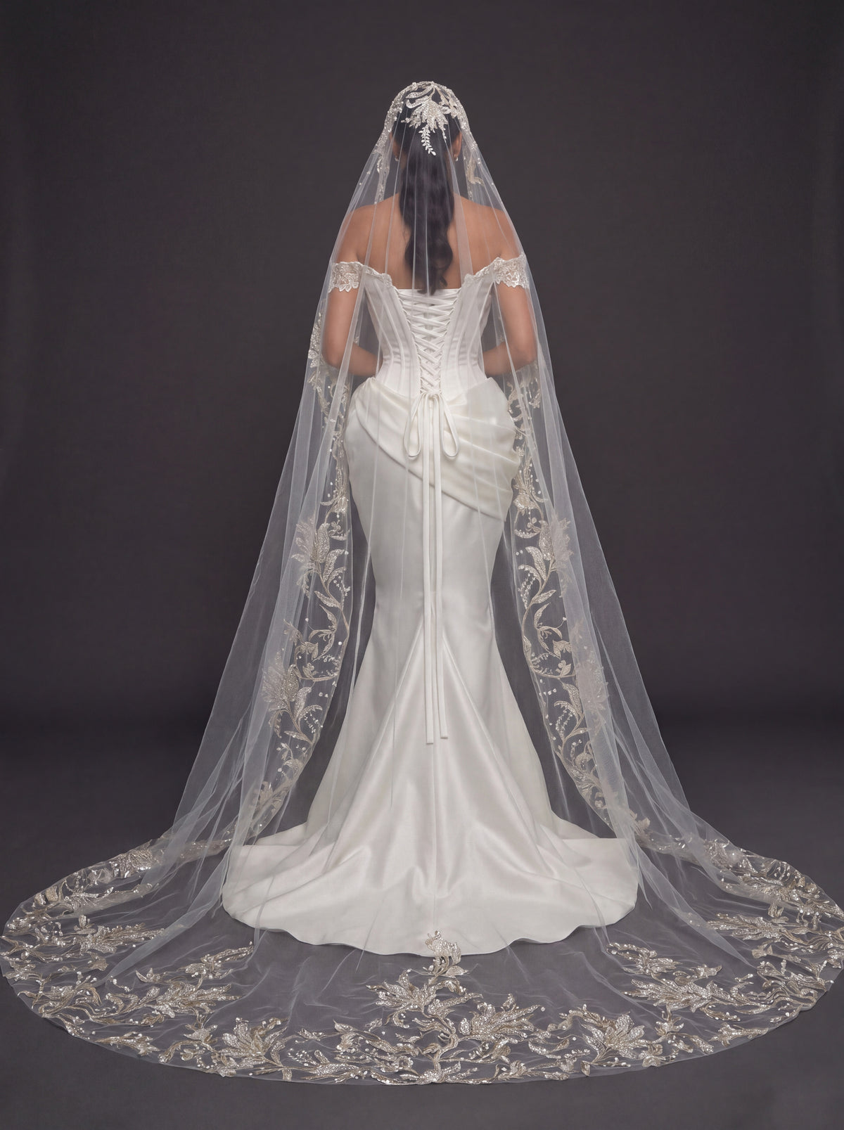 Ivory Satin Sculpted Corset Wedding Gown – Deep V-Neckline, Off-Shoulder Sleeves, Draped Mermaid Skirt & Floral Embroidered Cathedral Veil