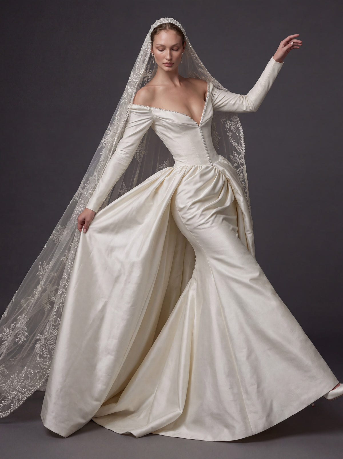 Pearl White Satin Corset Wedding Gown – Plunging Sweetheart Neckline, Draped Overskirt, Long Sleeves & Embroidered Cathedral Veil