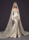 Champagne Satin Draped Mermaid Wedding Gown – Off-the-Shoulder Cowl Neckline, Pearl Button Corset, Front Slit & Floral Cathedral Veil