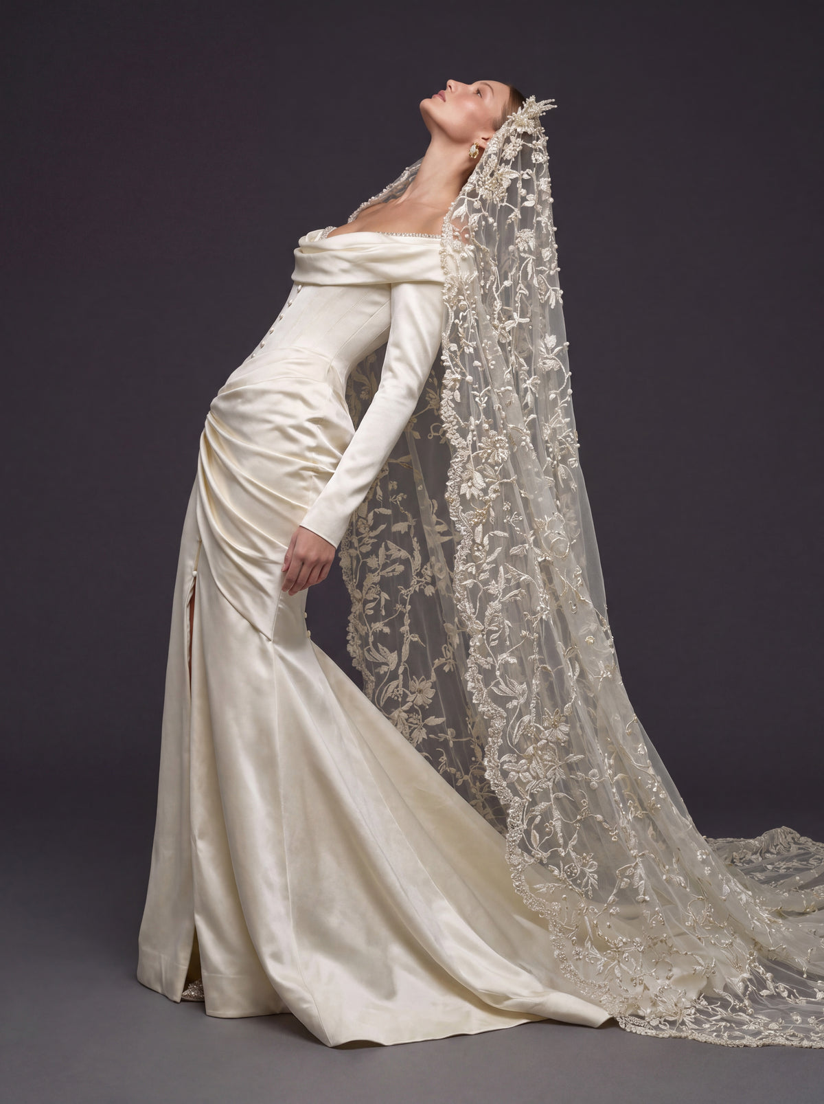Champagne Satin Draped Mermaid Wedding Gown – Off-the-Shoulder Cowl Neckline, Pearl Button Corset, Front Slit & Floral Cathedral Veil