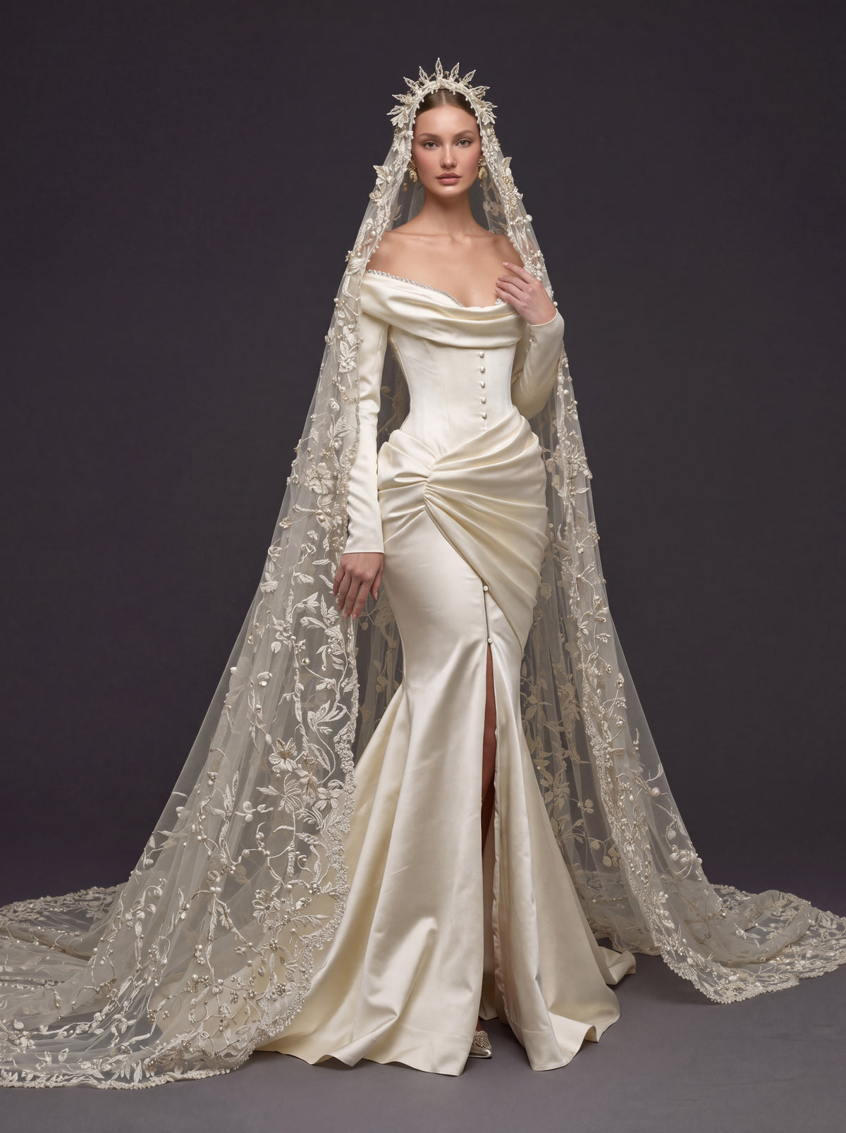 Champagne Satin Draped Mermaid Wedding Gown – Off-the-Shoulder Cowl Neckline, Pearl Button Corset, Front Slit & Floral Cathedral Veil