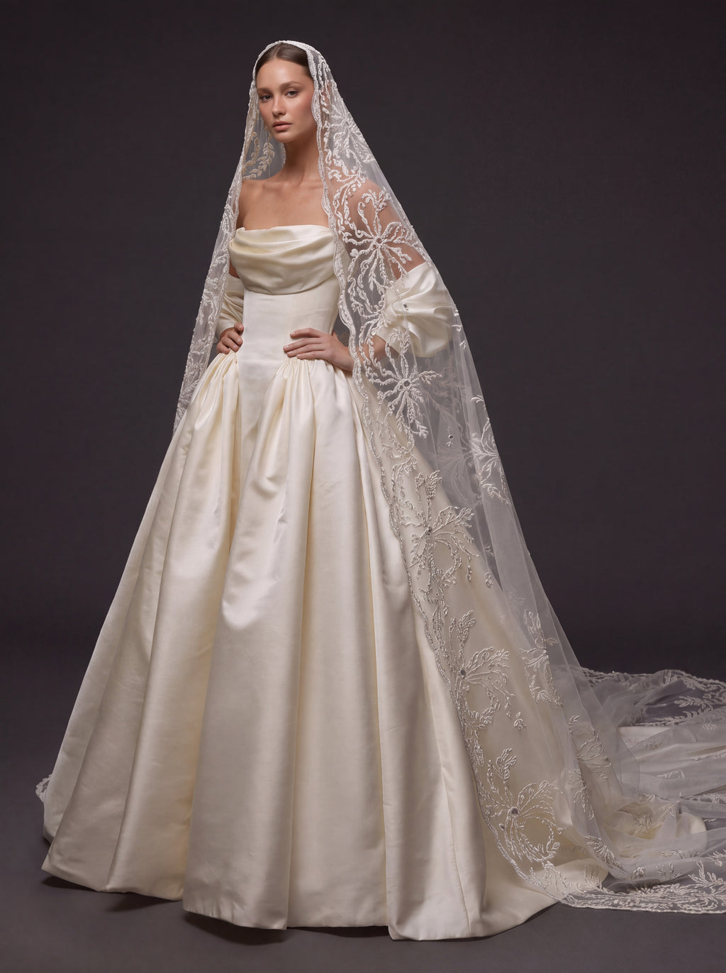 Pearl Ivory Satin Basque Waist Ball Gown Wedding Dress – Draped Strapless Neckline, Detachable Puff Sleeves & Embroidered Cathedral Veil
