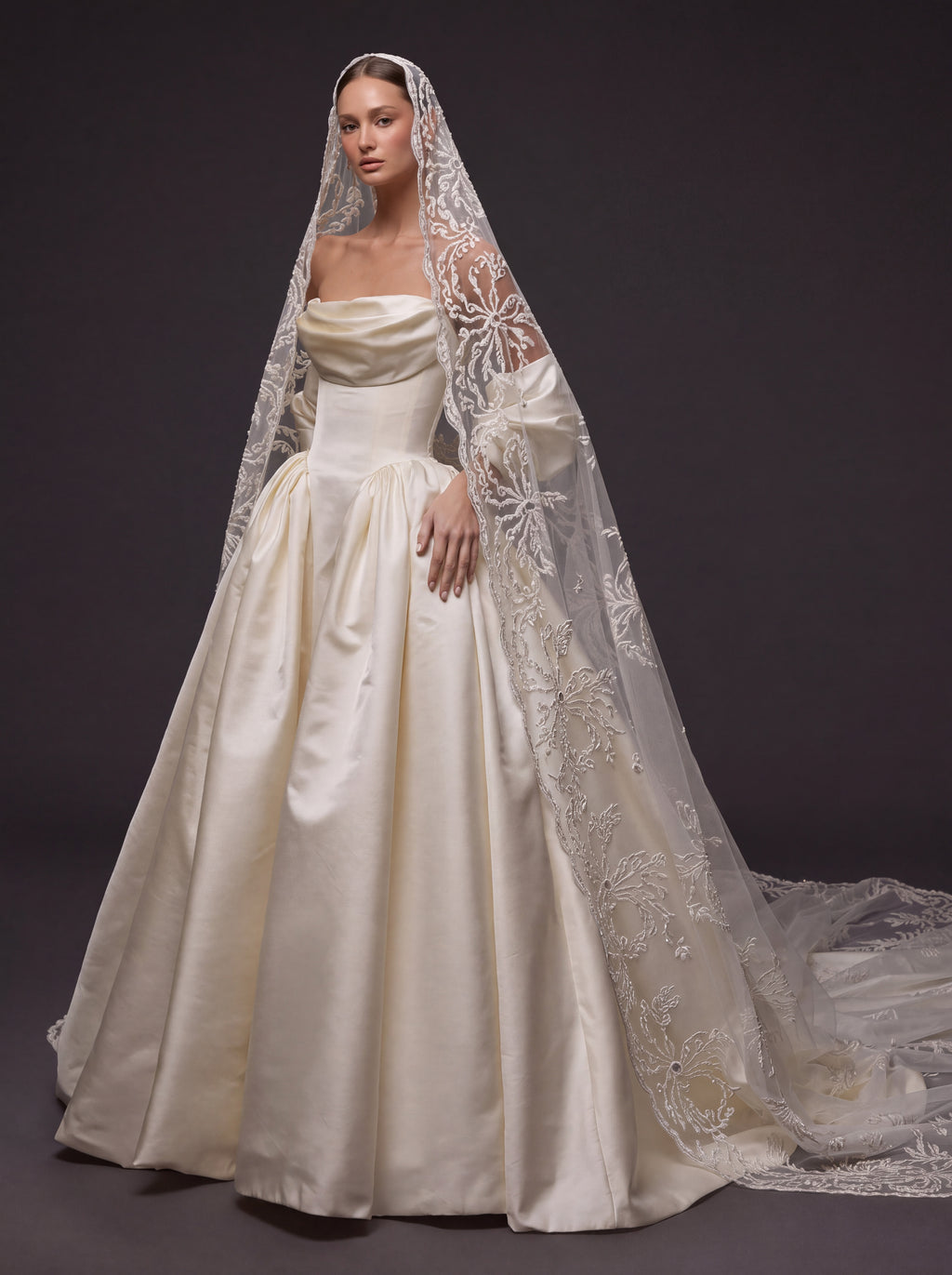 Pearl Ivory Satin Basque Waist Ball Gown Wedding Dress – Draped Strapless Neckline, Detachable Puff Sleeves & Embroidered Cathedral Veil
